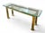 The unsigned table has a beveled glass top and a brass base. It has an Asian style, bracket corners with capped post tops,...