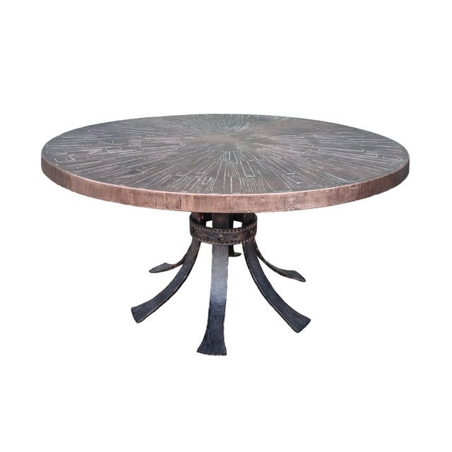 Striking round coffee table in a bold Brutalist / Spanish Revival style, made in Europe around the 1970s. The sculptural...