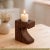 Dimensions: 5" W x 3" D x 7" H Aged wood with natural crevices has been used to craft these rustic candle holders.