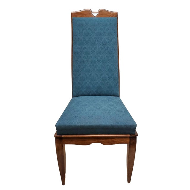 A set of six original French Mid Century Modernist tall dining chairs featuring angular lines with a curved moustache...