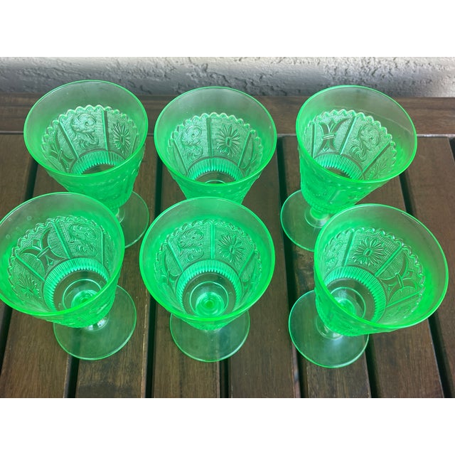 Here are a set of 6 pressed glass goblets I purchase at least 40 years back. The intricate embossed design is...