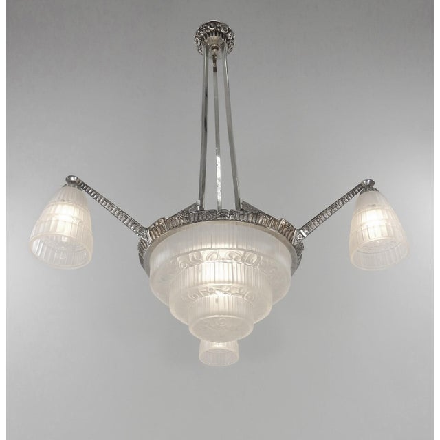 Cherrier et Besnus An exceptional 1920s Art Deco chandelier in nickel-plated solid brass or bronze. This exquisite piece...