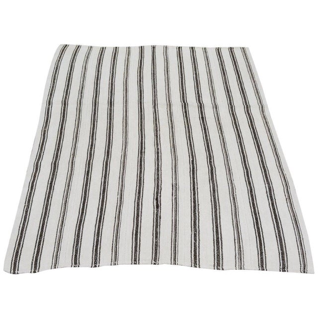 Hand-knotted with care using traditional rug-making techniques, this wool rug blends timeless craftsmanship with a modern...