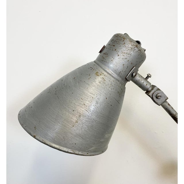 Large industrial table lamp with three adjustable joints made in former Czechoslovalia during the 1960s. It features a...