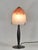 Schneider A French art deco lamp in wrought iron made around 1925-1930. It holds a beautiful colored dome in mottled...