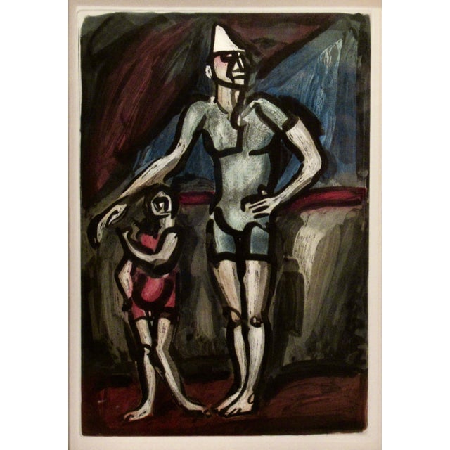 This artwork titled "Clown et Enfant (Clown and Child)" from the suite "Cirque (Circus) by Andre Suarez" created in 1930,...