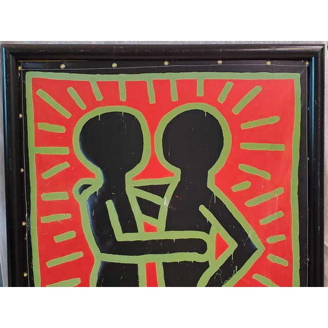 Framed K. Haring poster for the 1997 Whitney Museum exhibit. Copyright: The Estate of Keith Haring. Printed in Germany...