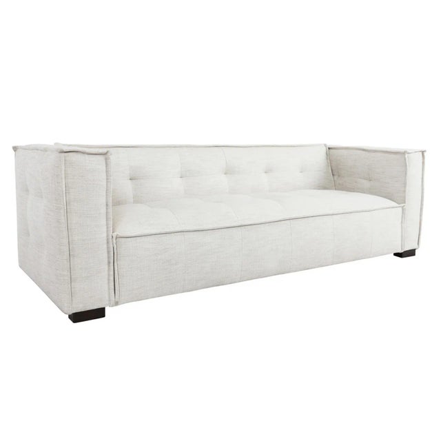 Contemporary and fresh poly blend upholstered modern sofa with squared tufted design. Relaxed sophisticated style makes...