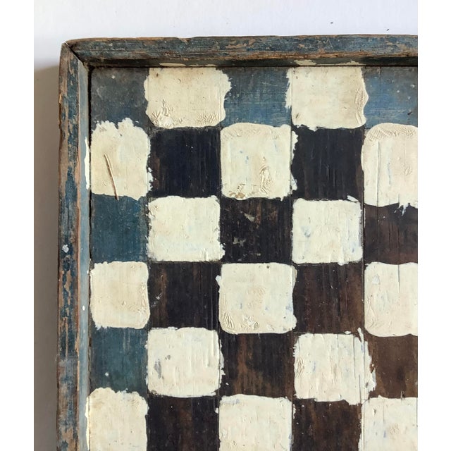 Found in Western Massachusetts early 1900s wood hand painted and hand made checkerboard in black, blue and white paint....