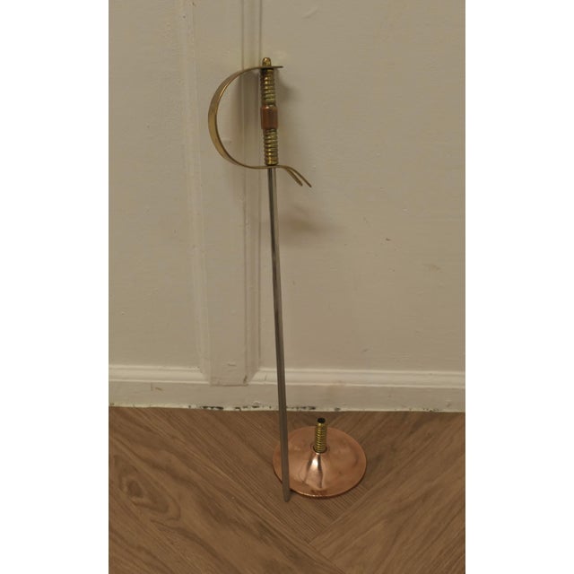 Very Stylish Arts and Crafts Copper and Brass Sword Poker A great and very practical piece, this superb steel poker has a...