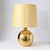 Vintage 1970s table lamp, designed by Aldo Londi and made by Bitossi. The lamp base is made of gold-glazed pottery. Given...