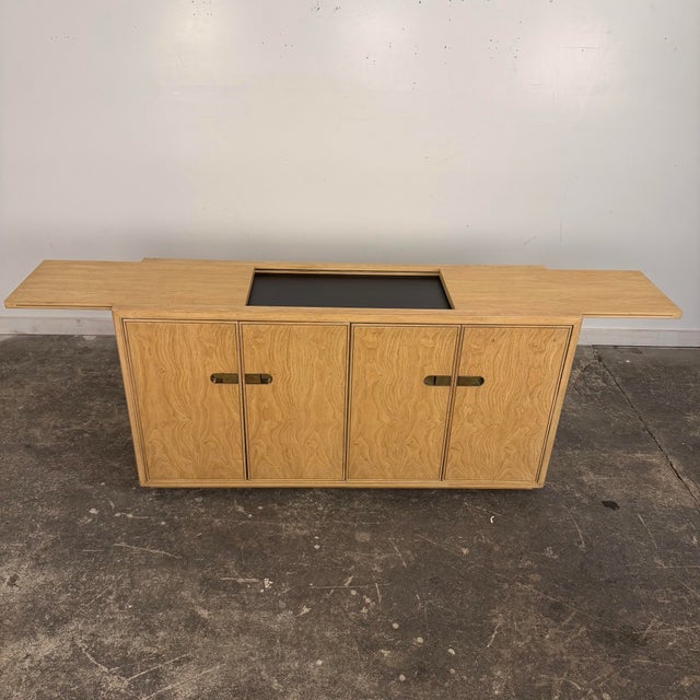 Credenza with extendable bar top from Drexel’s “Preface” line. This piece has campaign style brass door pulls that open to...