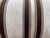 This bolster pillow features a classic striped pattern in brown and cream, creating a timeless, versatile look. The...