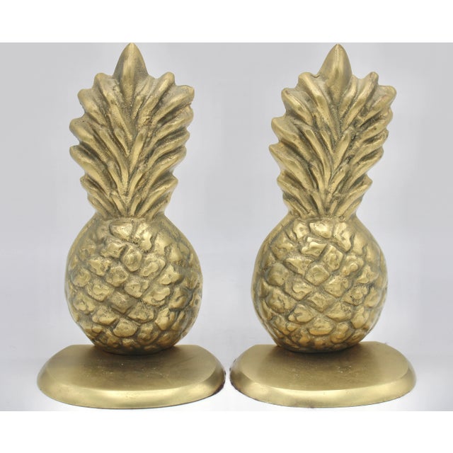 A stunning pair of unique brass pineapple bookends. This is a charming, statement pair of vintage pineapple bookends....