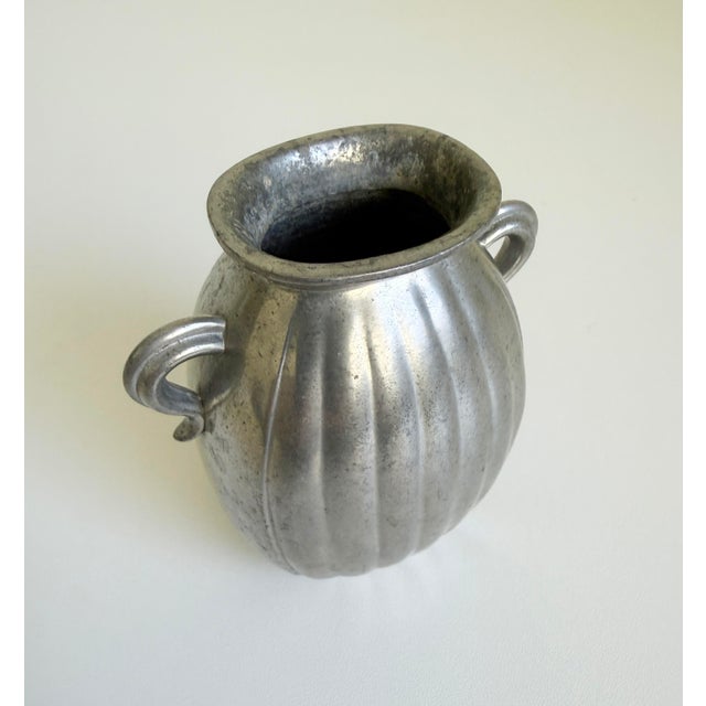 A vintage Scandinavian Art Deco pewter vase designed by the renowned Danish decorative artist Just Andersen and produced...