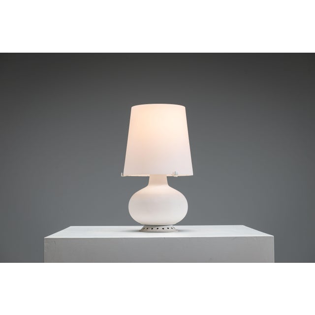 An iconic example of mid-century Italian lighting, the Model 1853 table lamp by Max Ingrand for Fontana Arte embodies a...