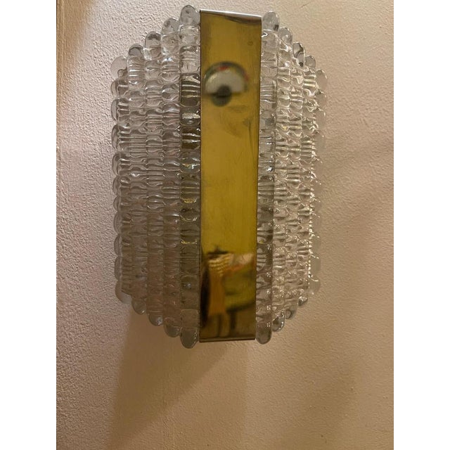 Beautiful pair of rounded murano glass wall sconces with chrome brackets by kaiser leuchten, germany, circa 1970s. High...