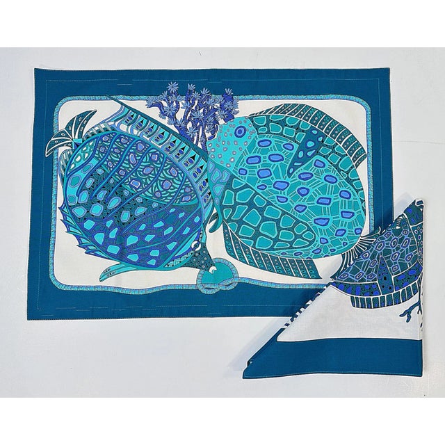 This is a vintage 1980's Hermes Placemat and matching napkin. The design is a fabulous Hermes fish design known as their...