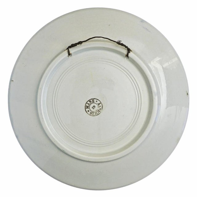 This charming piece features a Dutch coastal scene with sailboats and serves as a lovely accent for a beach house...