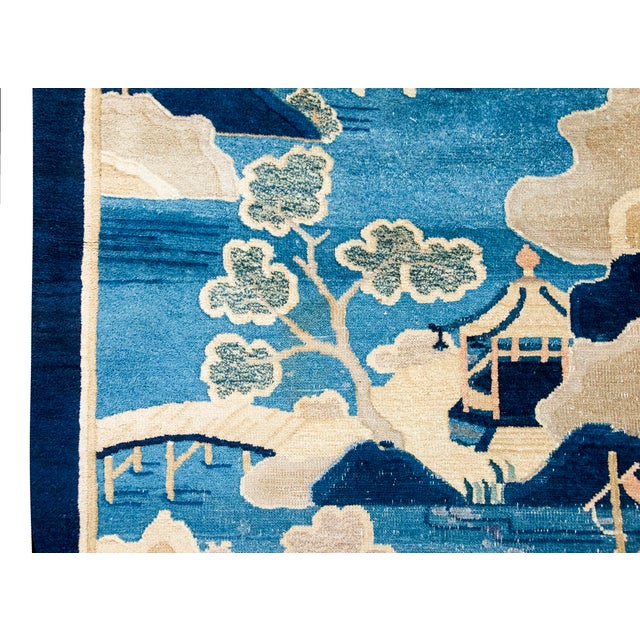 This exquisite 1920s Chinese Art Deco pictorial rug features a beautifully rendered landscape scene in shades of blue,...