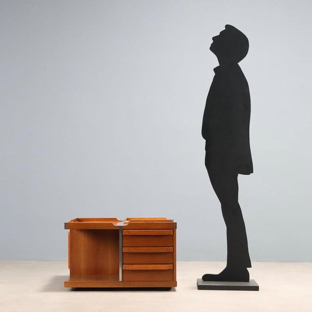 This multifunctional coffee table from the 1970s combines aesthetics and practicality. Crafted from Tanganyika Walnut...