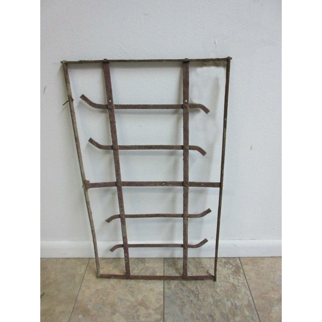This iron window is a wonderful piece of architecture and is heavy, tight, and sturdy. The piece does shown signs of wear...