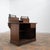 Oak pharmacy counter, French work from the early 20th century. Front with molded panels and architectural decoration. Back...