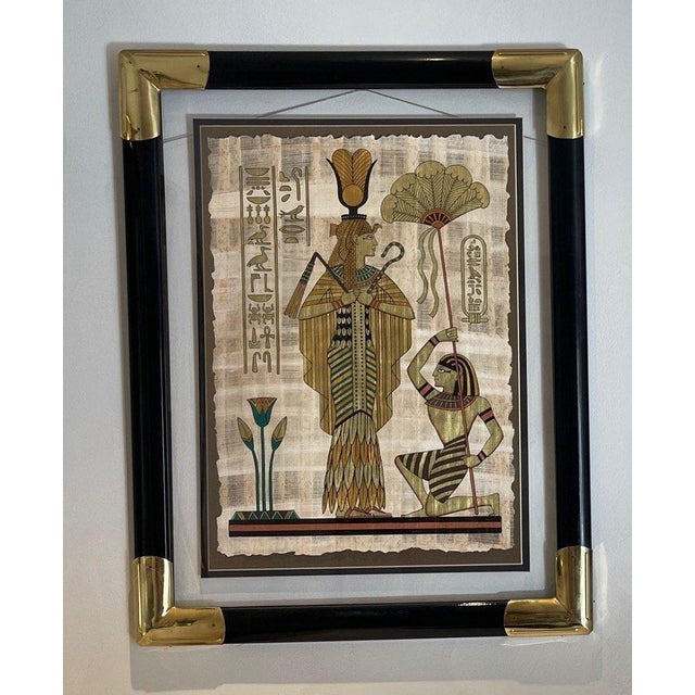 Pair of paintings with Egyptian figures. Custom black and brass frames. True statement pieces!