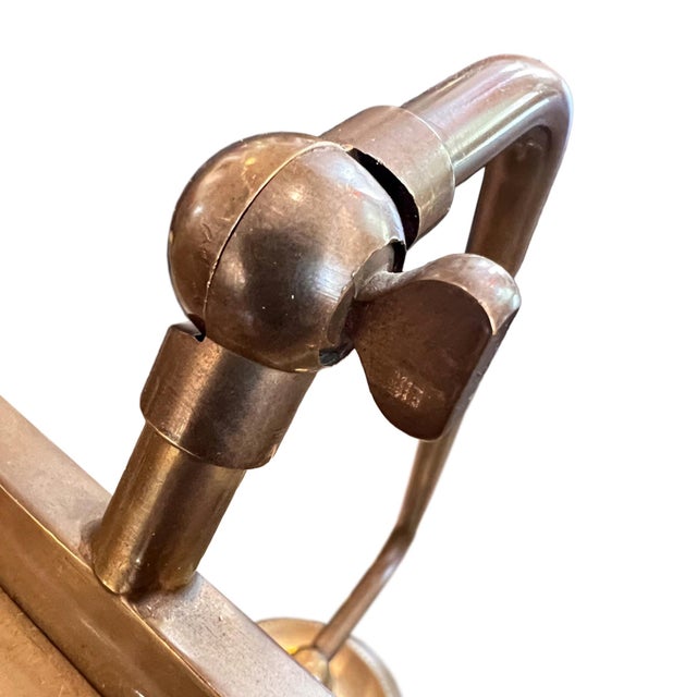 A lovely little desk lamp, made in France in the 1930s from brass. We've had it rewired for the UK using black rope...