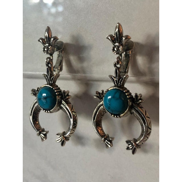 These fabulous 1950s Arthur Pepper (ART) Turquoise and Silver Squash Blossom Earrings brings southwestern flair and...