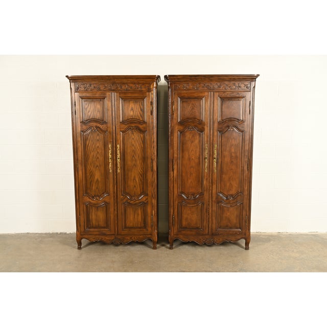 A gorgeous pair of French Provincial Louis XV style armoire dressers or linen presses By Baker Furniture USA, Circa 1980s...