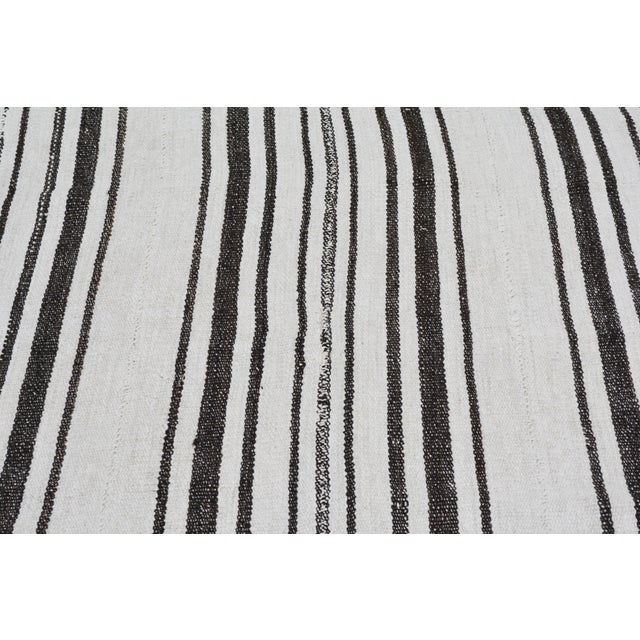 Flatweaved with care using traditional rug-making techniques, this wool rug blends timeless craftsmanship with a modern...