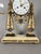 Louis XVI period portico clock. Portico clock with two white marble columns on a black marble base. Adorned with a gilt...