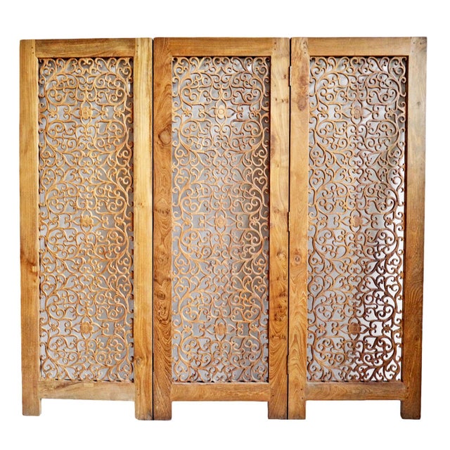 Stunning vintage teak carved room divider screen. Impressive solid three panel hinged screen with scroll lace work cut out...