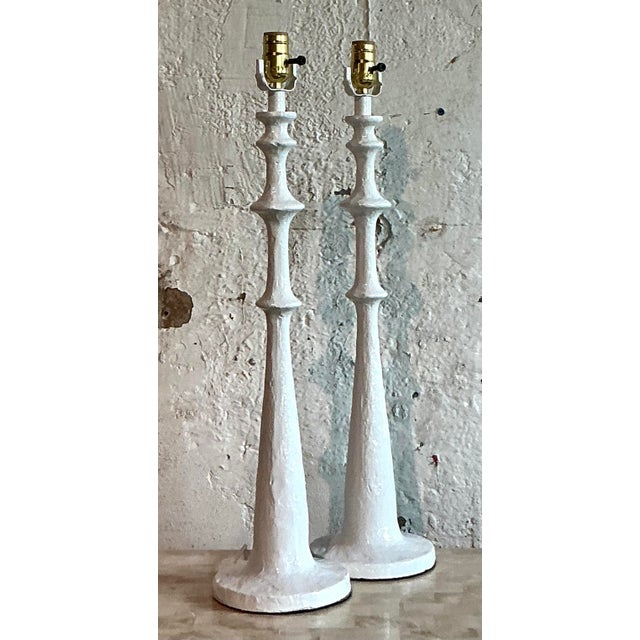 Illuminate your space with the timeless elegance of this striking pair of vintage spool lamps. Featuring a classic...