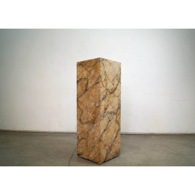 Vintage 1970's Midcentury Modern pedestal stand table for sale. It's made of laminate in a faux marble finish, and is...