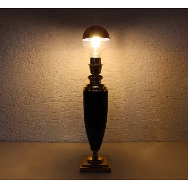 Nice table lamp in brass and leather. Produced by the French brand Le Dauphin in the 50s and 60s. A vintage and modern...