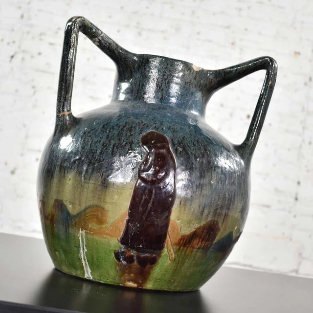 Handsome Art Nouveau Flemish earthenware three handled vase with applied L.M.V mark and decorated with figures in...