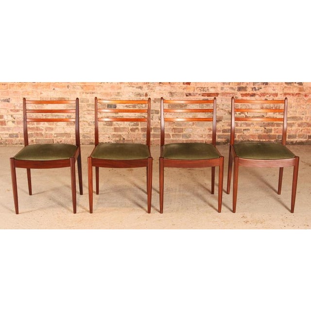 A set of four midcentury g plan dining chairs circa 1960s. Green velvet upholstery in excellent condition. H: 83.5cm w:...