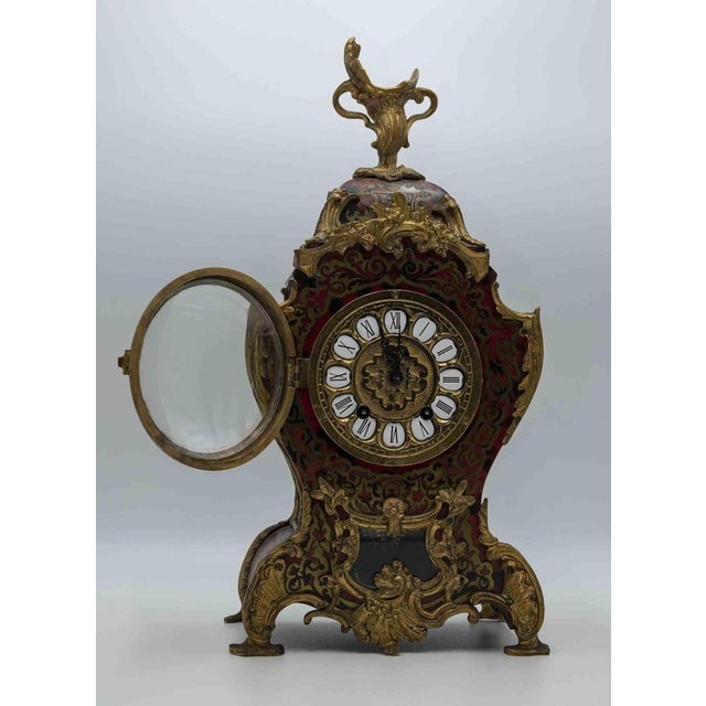This beautiful Clock in "Boulle" Style was realized in the early century. Kienzle Manifacture. In working order. Good...