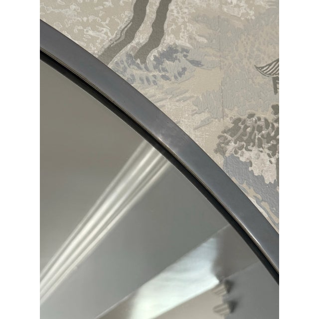 Striking large wall mirror from France, circa 1930. Nickel frame. Elegant, gracious, and classic.