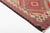 This is a vintage Turkish Oushak rug from the Mid 20th Century. The piece was hand-knotted.