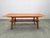 Refined Danish mid century coffee table from the 1960s, executed in solid teak with a teak veneered top. The sculptural...