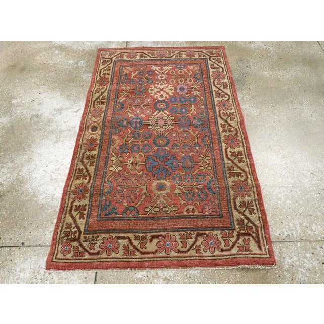 This early 20th century East Turkestan Khotan rug, measuring 3' 1" x 5' 0", showcases a vibrant composition rooted in...
