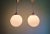 Pair of large Art Deco pendant lights with a white opaline globe (30 cm diameter) and a chrome-plated metal frame,...