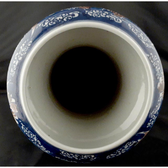 Chinese porcelain Fu Bats fengweizun, a finely formed, phoenix-tail vase with a cobalt blue glazed exterior, and a white...