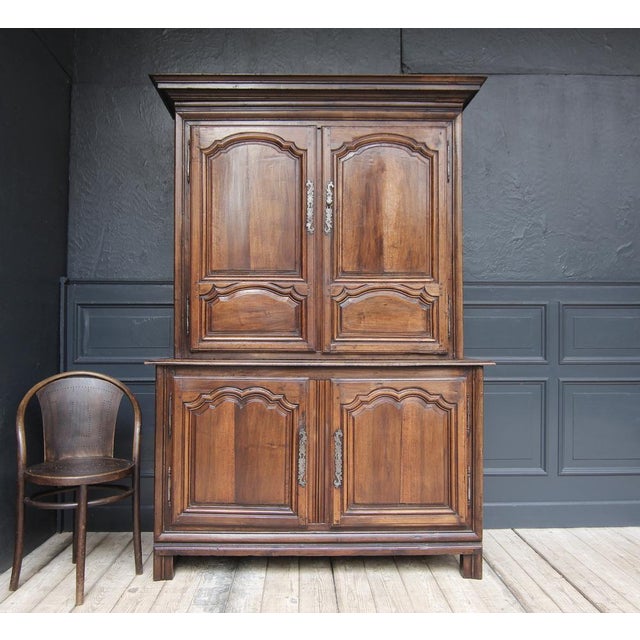 French buffet à deux corps or cabinet in Louis XIV style. Early 19th century. Made from solid walnut. Two-part side-...