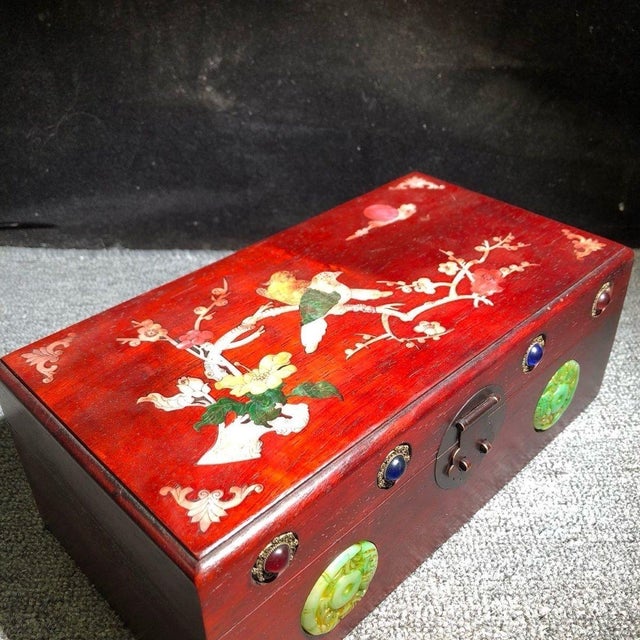 A stunning and highly decorative vintage Chinese hardwood jewelry box, crafted from rich, reddish-brown Huali (Rosewood)....