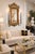 Offering a unique vintage Porcelain & Ormolu beveled wall mirror done in a French Rococo style, circa 1960s. The burgundy...