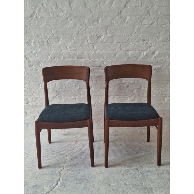 Pair of Henning Kjaernulf for Korup Mobelfabrik 1960s Danish dining chairs in solid teak, seats recently re-covered with a...
